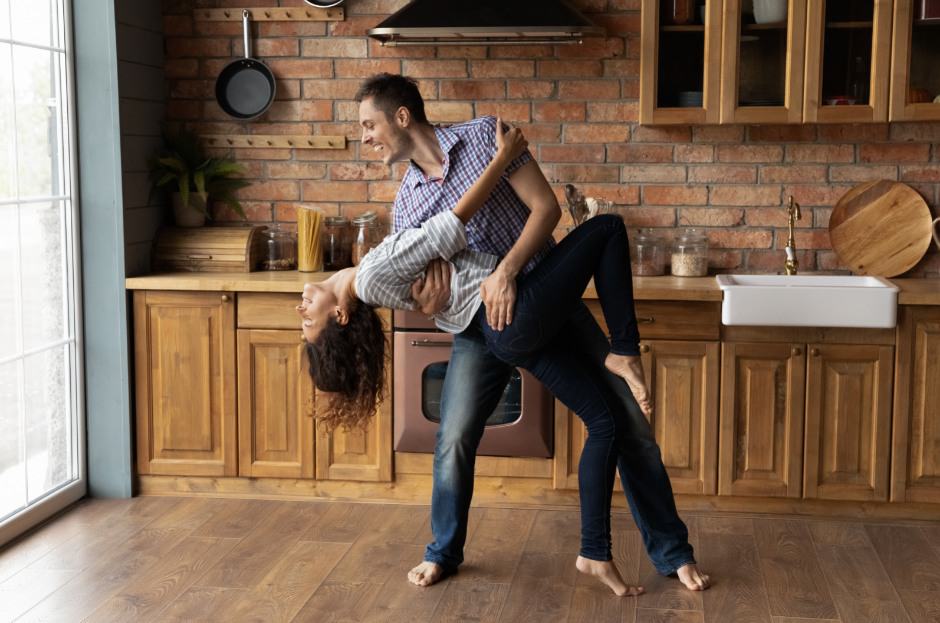 A couple dancing in the kitchen