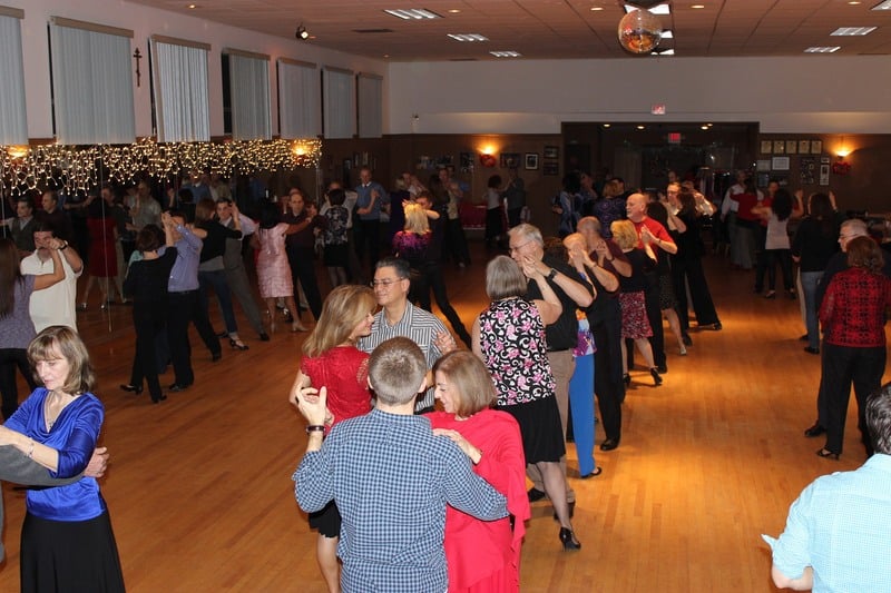 A group of adults seen at a social dancing event